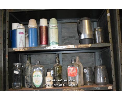 SHELF OF THERMOS FLASKS