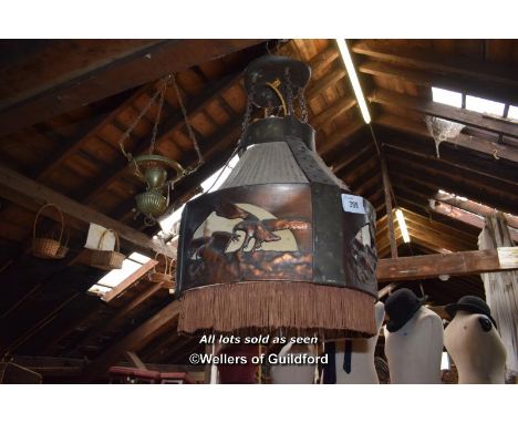 AN ORNATE LAMPSHADE DECORATED WITH BIRDS OF PREY TOGETHER WITH A BRASS LIGHT FITTING