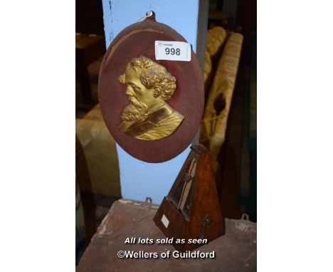 WOODEN METRONOME TOGETHER WITH A PORTRAIT WALL PLAQUE