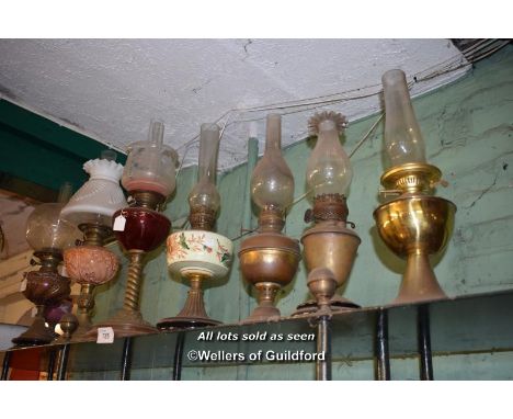 SHELF TOP OF EIGHT MIXED OIL LAMPS