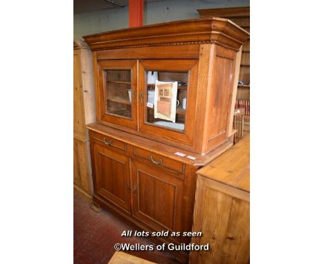 19TH CENTURY CONTINENTAL OAK CABINET WITH TWO GLAZED DOORS OVER AN OPEN SHELF WITH DRAWERS AND CUPBOARDS BELOW, 142CM WIDE (1