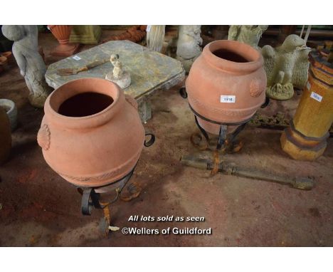 PAIR OF TERRACOTTA PLANTER JARS ON WROUGHT IRON BASES