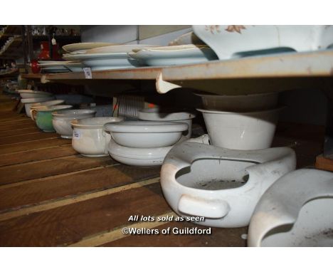 LARGE SHELF OF PORCELAIN BEDPANS