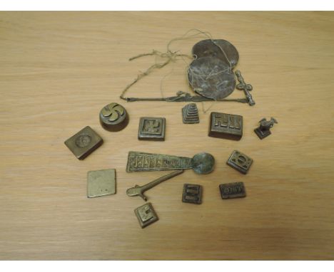 A collection of West African Gold Weights with scale