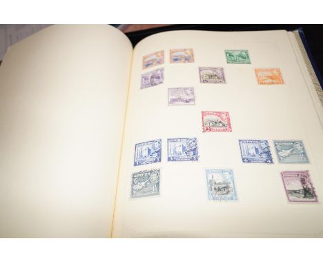 Nice old blue spring back stamp album, containing a mix of world and commonwealth stamps, both mint and used. Early to mid-pe