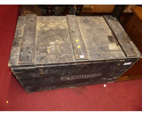 An early 20th century stained and planked pine hinge topped travel trunk, having iron end carry handles, w.104cm 