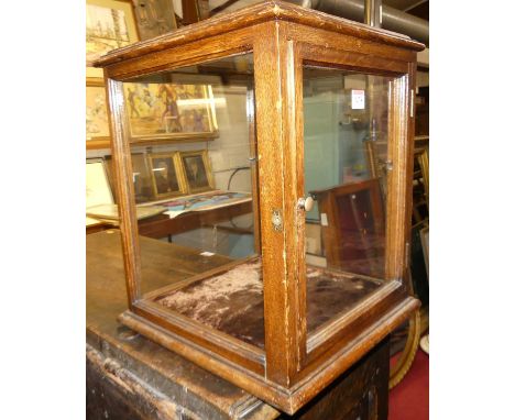 An early 20th century oak square table top curiosity display cabinet, glazed on all sides with rear door, 35.5x35.5x42cmMissi