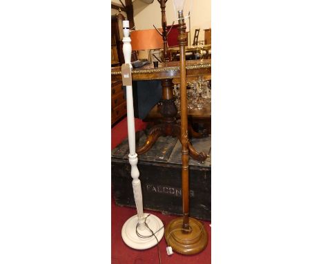 A white painted turned standard lamp, together with turned beech standard lamp (2) 