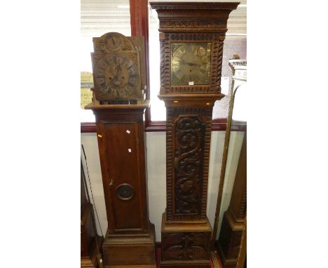 A relief carved oak longcase clock, having a brass square dial, with pendulum; together with a further oak cased longcase clo