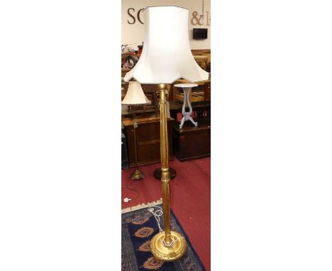 A gilt wood fluted standard lamp