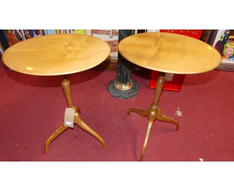 A pair of 20th century satin wood oval fixed top pedestal tripod occasional tables, each width 48cm