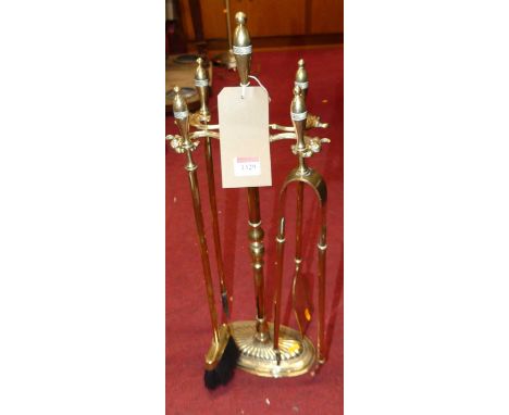 Sundry turned brass fire tools on stand (5)height of stand 65cm