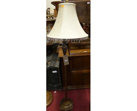 A French style painted metal standard lamp with floral detail