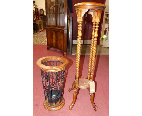 A contemporary cherrywood circular two-tier plant stand, height 1-1cm, together with a contemporary hardwood and wired metal 