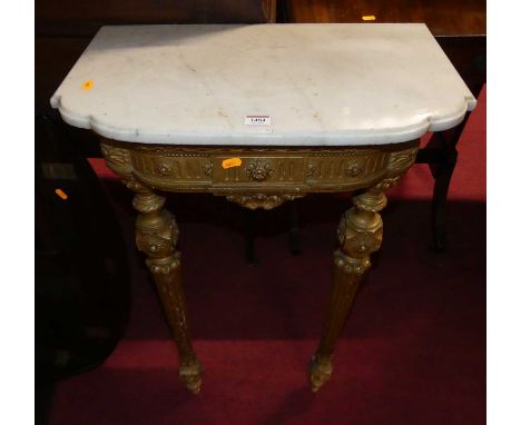 A 19th century French gilt wood and white marble topped console occasional table of slightly bowed form, raised on floral dec