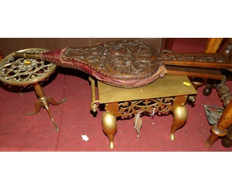 A collection of various 19th century fireside wares to include; two brass footman, two sets of relief carved oak bellows, war