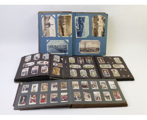Vintage postcard album and three cigarette card albums 