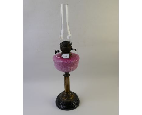 Vintage column oil lamp with cranberry milk glass reservoir 