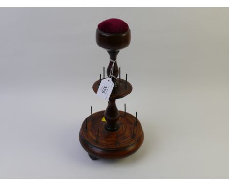 Turned wooden sewing thread bobbin holder with pincushion top, 34 cm high