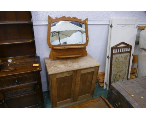 Scrubbed pine style cupboard and shaped and shelved mirror 