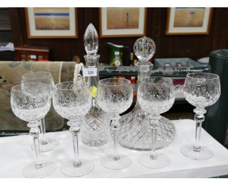 Two decanters and set of six etched and cut glass wine glasses 