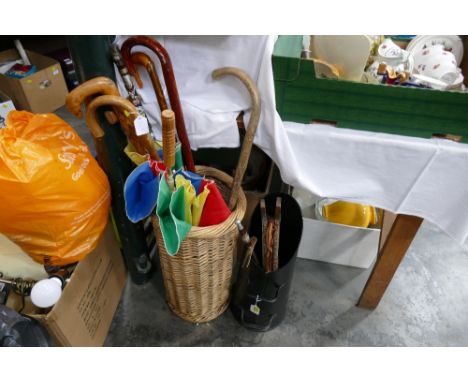 Wicker stick stand and sticks and umbrellas, coal bucket, fireside accessories