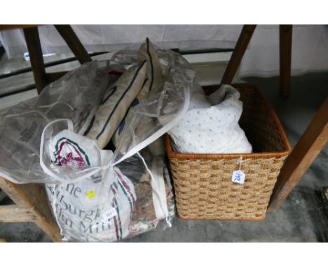 Wicker basket, vintage quilt and quantity of fabric