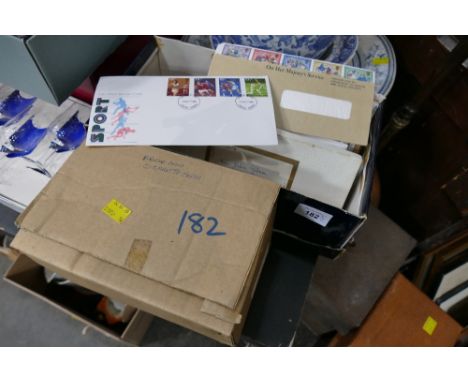 Two boxes of tea card albums and first day covers 