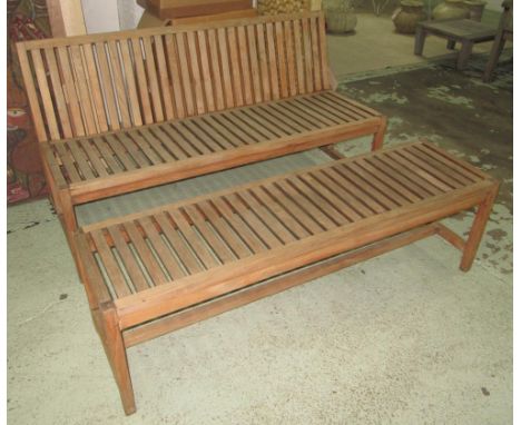 GARDEN BENCH, weathered teak and slatted construction together with a conforming low table/bench, both 146cm W. (2)