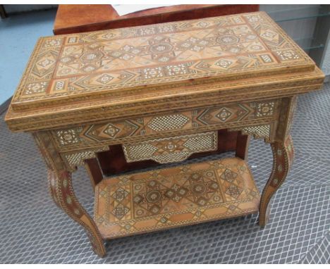 GAMES TABLE, Islamic style with foldover top and shelf below, 81cm x 40cm x 80cm H. 