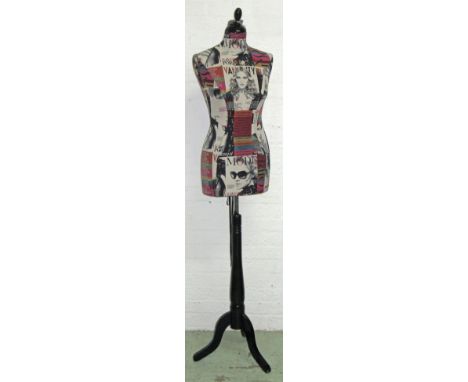 DISPLAY MANNEQUIN, on black wooden tripod stand covered in 'Madonna' magazine theme fabric, corset laced up the back with sat