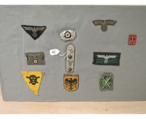 A collection of German Cloth Badges, Visor Cap Wreath, Panzer Breast Eagle, M38 Heer Officers Bevo Cap T-Eagle Insignia, WWII