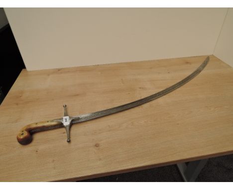 A British Cavalry Mameluke Sword possibly Dragoon Guards, C.1825, no scabbard, bone grip, highly decorated curved blade, blad