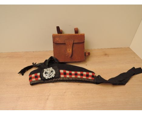 A Glengarry having Liverpool Scottish The Kings Badge with black feather, dated J &amp; W Hood &amp; Co 1962 with Military Ar