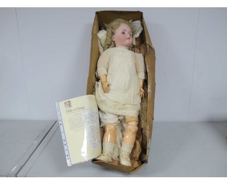 Handwerck Germany; A Bisque Headed Composition Doll, the back of the head stamped "HANDWERCK GERMANY 61/2", with functioning 