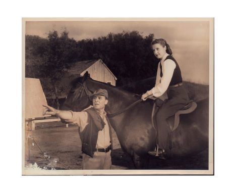 Black and white photo with a scene from the film 'Cry Wolf', featuring Barry Bernard and Barbara Stanwyck.'Barry Bernard, Bar