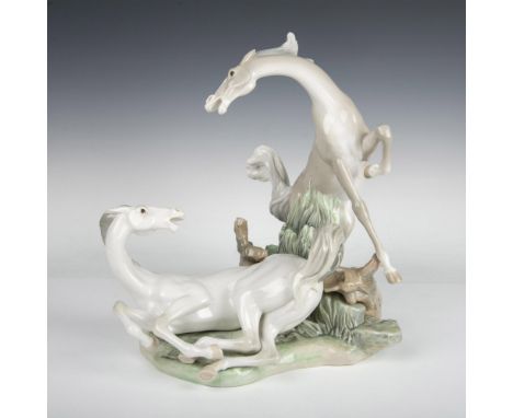 Glossy finish two horses playing. Light brown and blue coloration. Lladro backstamp. Artist: Fulgencio GarciaIssued: 1969-198