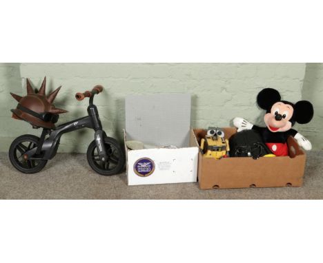 A collection of toys, including a box of Lego pieces, Smyths balance bike and helmet, electronic toys and soft toy etc.