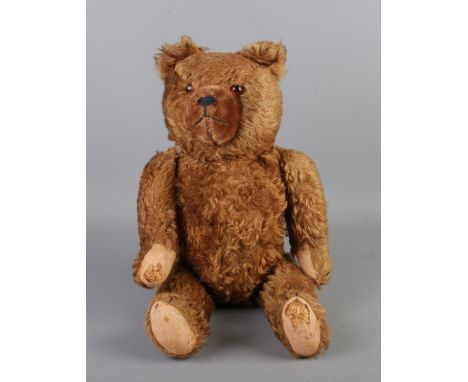 An early to mid 20th century jointed bear, possibly Hermann. Seated height 33cm.