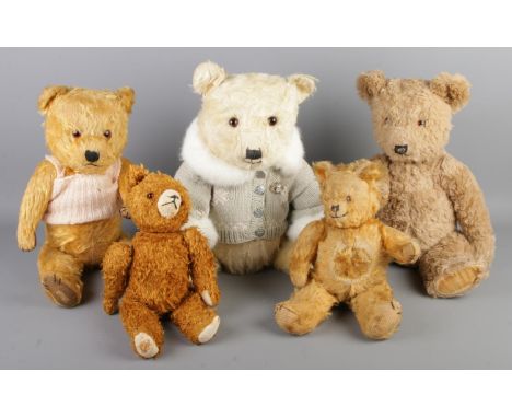 Five vintage bears including Chiltern examples.