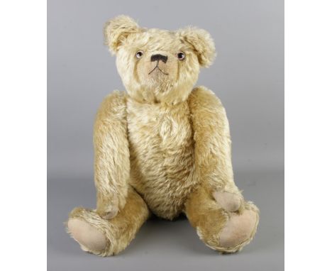 An early 20th century Farnell mohair jointed bear. With growler. Seated height 43cm.