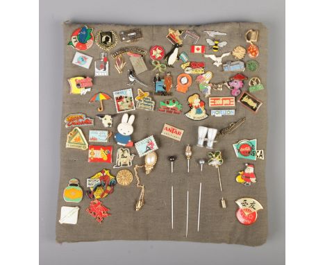 A good collection of pin badges and stick pins including Spiderman, Slayer, Flying Scotsman and Canada examples