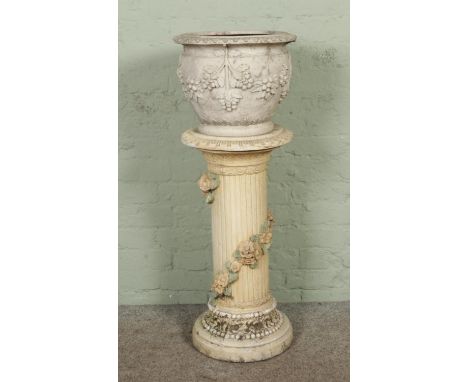 A terracotta garden urn planter on stand, overall height 107cm.