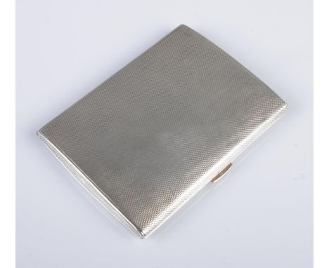 A George V silver cigarette case. With engine turned engraving and 9ct gold thumb piece/clasp button. Assayed Chester 1924 by