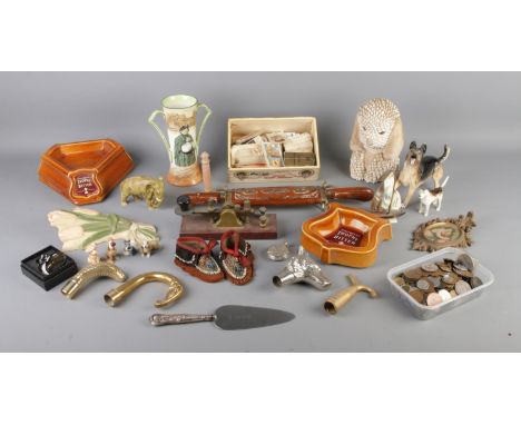 One box containing a good quantity of collectables. To include Whitbread Trophy Bitter ashtrays, walking stick pommels, cigar