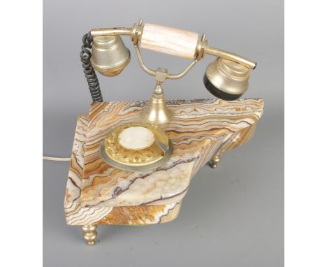 An onyx and gilt metal rotary telephone.