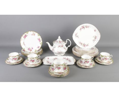 Two ceramic part tea services. Consisting of Royal Albert Lavender Rose and Aynsley Wilton Green. Teapot, cups and saucers, s