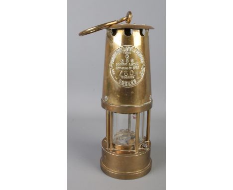 An Eccles Type 6 brass miner's safety lamp by the Protector Lamp and Lighting Co. Ltd. stamped number 760.
