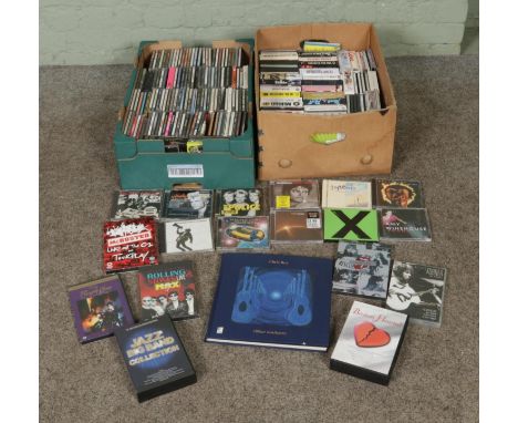 Two boxes of assorted CD's and live concert DVDs of mainly pop and rock to include The Police, ABBA, Michael Jackson, Genesis