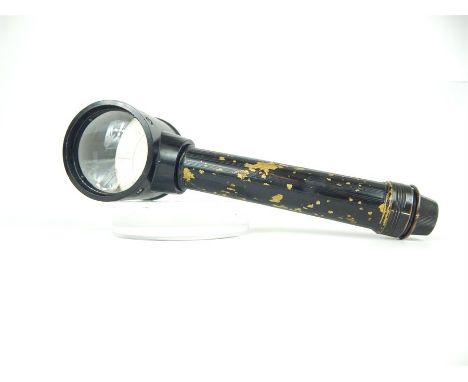 A vintage air force style black painted magnifying glass, possibly a map reader; with indistinct printed serial number and ma